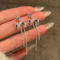 Playful Copper Zircon Bow Tassel Drop Earrings With Silver Pins For Elegant Daily Wear view 1