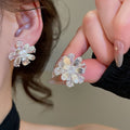 Light Luxury Copper Floral Stud Earrings With Glazed Flower And Sparkling Rhinestone Design view 2