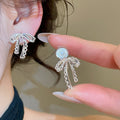 Korean Sweet Princess Faux Pearl Zircon Bow Clip-on Earrings, Light Luxury No-Piercing Ear Jewelry view 1