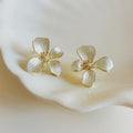White Enamel Flower Faux Pearl Stud Earrings For Women 2026 Fashion OL Light Luxury Silver Needle Jewelry view 3