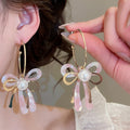 Vacation Style Acetate Bow Faux Pearl Stud Earrings With Silver Pins view 1