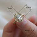 Gold Tone Oval Cluster Halo Ring In A Polished Decorative Design view 5