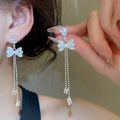 Light Luxury Copper Bowknot Drop Earrings With Sparkling Zircon Tassel Design view 4