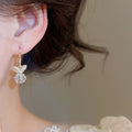 Light Luxury Copper Pearl Flower Knot Tassel Drop Earrings With Ear Hook Design view 3