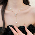 Light Luxury French Gold Rhinestone Leaf Faux Pearl Pendant Sweater Necklace For Women view 3