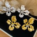 Alloy Zircon Hollow Flower Stud Earrings Irregular Metal Floral Light Luxury Fashion Jewelry view 1
