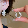Korean Style Hollow Copper Ear Cuff Earrings With Zircon Accents, Light Luxury Round Design view 4