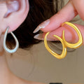 Copper Twisted Oval Stud Earrings Minimalist Modern Geometric Light Luxury Jewelry view 1