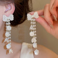 Elegant Faux Pearl Bow Zircon Petal Tassel Drop Earrings With Silver Posts view 1
