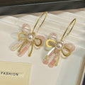 Elegant French Pearl Bowknot Gold Alloy Hoop Earrings With Pink Acrylic Petal Dangle Earrings view 4