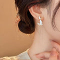 Light Luxury Alloy Butterfly Stud Earrings With Rhinestone Drip Oil And Asymmetric Pearl Design view 3