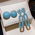 Light Luxury Copper Stud Earrings With Blue Zircon Oval Hollow Geometric Design view 3
