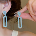 Light Luxury Copper Stud Earrings With Blue Zircon Oval Hollow Geometric Design view 4