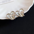 Korean Playful Alloy Heart Butterfly Pearl Stud Earrings For Women Elegant Silver Needle view 3