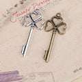 Clover Bow Vintage Key Metal Charm in Three Finishes view 1