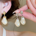 French Vintage Irregular Oval Faux Pearl Stud Earrings With Silver Posts Light Luxury Geometric Jewelry view 1