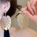 Luxury Iron Hollow Leaf Fan Geometric Stud Earrings Exaggerated Statement Design view 3