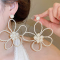 Elegant French Floral Hollow Faux Pearl Stud Earrings With Silver Needle Posts view 1