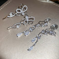 2026 Sparkling Zircon Heart Waterdrop Tassel Copper Clip-on Earrings With Playful Bow Accent view 4