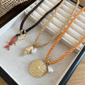 Old Money Vacation Style Cord Necklace With Metal Goldfish And Crinkled Round Pendant view 2