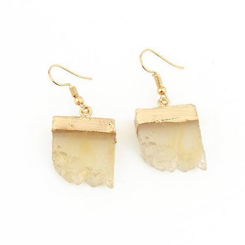 Pair of cream beige irregular resin crystal drop earrings with gold caps