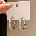 Light Luxury Copper Zircon Diamond Hollow Round Stud Earrings With Silver Pins view 4