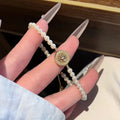 18K Gold Plated Zirconia Faux Pearl Beaded Bangle Light Luxury Geometric Round Bracelet view 1