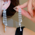 Light Luxury Copper Double C Tassel Drop Earrings With Silver Posts For Evening Wear view 1
