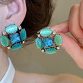 Vintage Old Money Cat Eye Stone Oval Stud Earrings With Crystal Accents And Silver Posts view 3