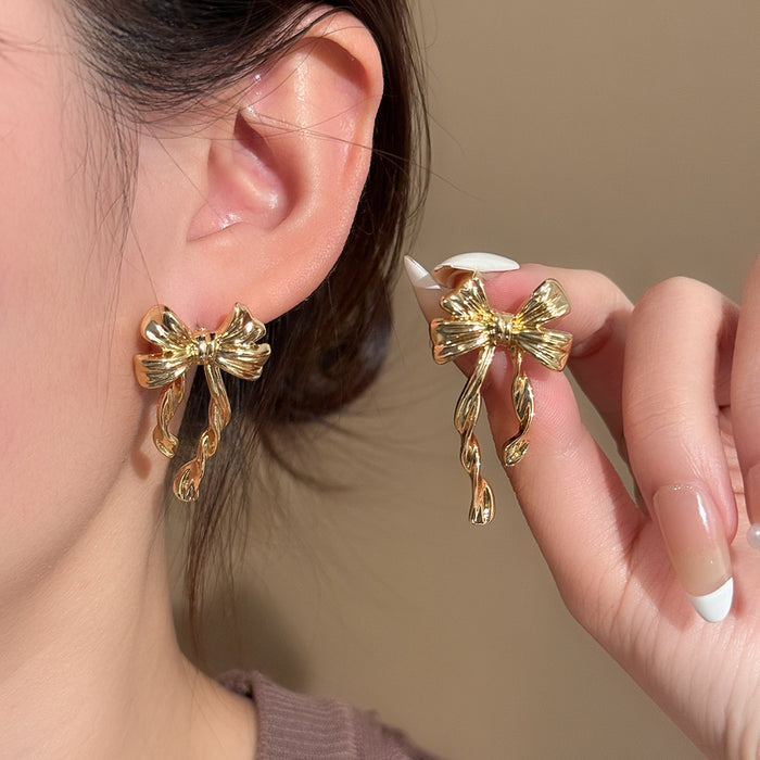 Light Luxury Gold Alloy Bowknot Stud Earrings, Elegant Niche Design Textured Ribbon Drop Fashion Earrings