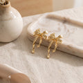 Light Luxury Gold Alloy Bowknot Stud Earrings, Elegant Niche Design Textured Ribbon Drop Fashion Earrings view 4