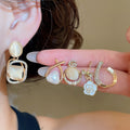 Light Luxury Cat Eye Stone Pearl Flower Geometric Stud Earrings With Silver Needle view 2
