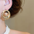 Alloy Round Hollow Pearl Stud Earrings For Women Light Luxury Geometric Jewelry view 3