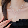Light Luxury Double Layer Faux Pearl Necklace With Sparkling Zircon Starburst Pendant For Women view 3