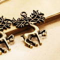 Reindeer Under Branches Metal Charm in Three Finishes view 5