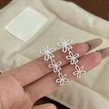 Elegant Gold Alloy Hollow Flower Drop Stud Earrings For Women Korean Long Dangle Floral Earrings view 4