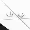 Gold Tone Crescent Moon Stud Earrings with Textured Surface Detail view 5