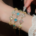 18K Gold Plated Copper Zircon Round Flower Bangle Court Style Geometric Bracelet For Women view 3
