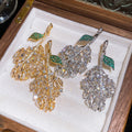 Light Luxury Copper Zircon Hollow Leaf Stud Earrings For Elegant Evening Wear view 4