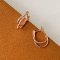 Small Commuter Hoop Earrings With Fashion Line Design And Micro Pave Zircon Detail view 3