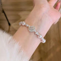 French Style Rhinestone Camellia Faux Pearl Bangle Elegant Light Luxury Floral Bracelet For Women view 2