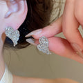 18K Gold Plated Copper Heart Stud Earrings With Zirconia Crumpled Texture Light Luxury Jewelry view 3
