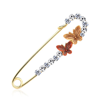 Front product view of the ribbon bow brooch pin in gold and silver