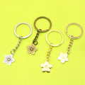 Metal Five-Petal Plum Blossom Keychain Bag Charm view 1