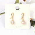 Gold Wire Wrapped Pink Pearl Look Small Huggie Earrings view 3