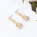 Gold Wire Wrapped Pink Pearl Look Small Huggie Earrings view 4