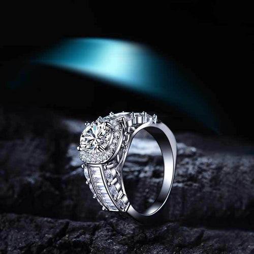 silver-tone round halo crystal ring shown from a side angle
