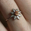 Silver Daisy Flower Ring With Amber Center In A Polished Decorative Design view 3