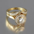 Round Halo Solitaire And Curved Band Two-Ring Set In Gold Tone view 2