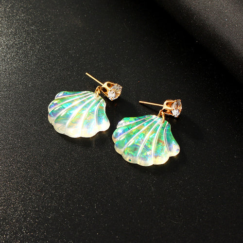 Iridescent opal shell resin earrings gold posts clear stone tops close-up